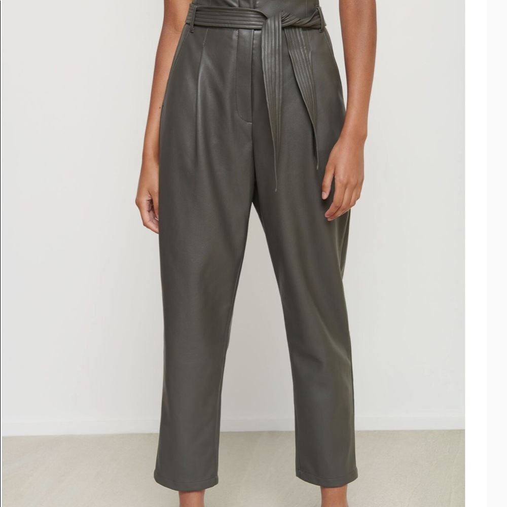 Belted faux leather high waisted pants.